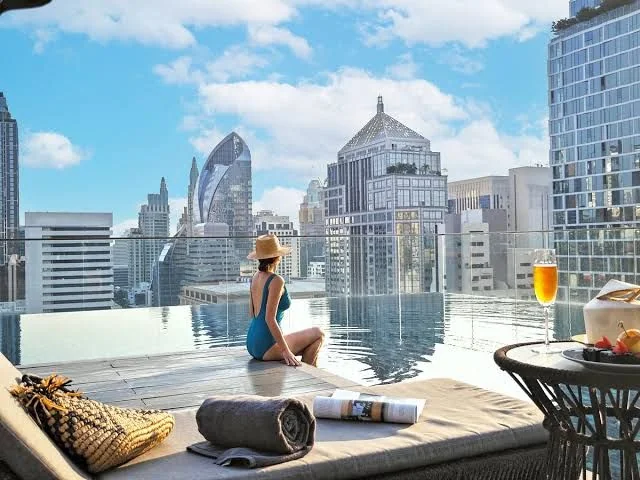 A rooftop infinity pool above the city